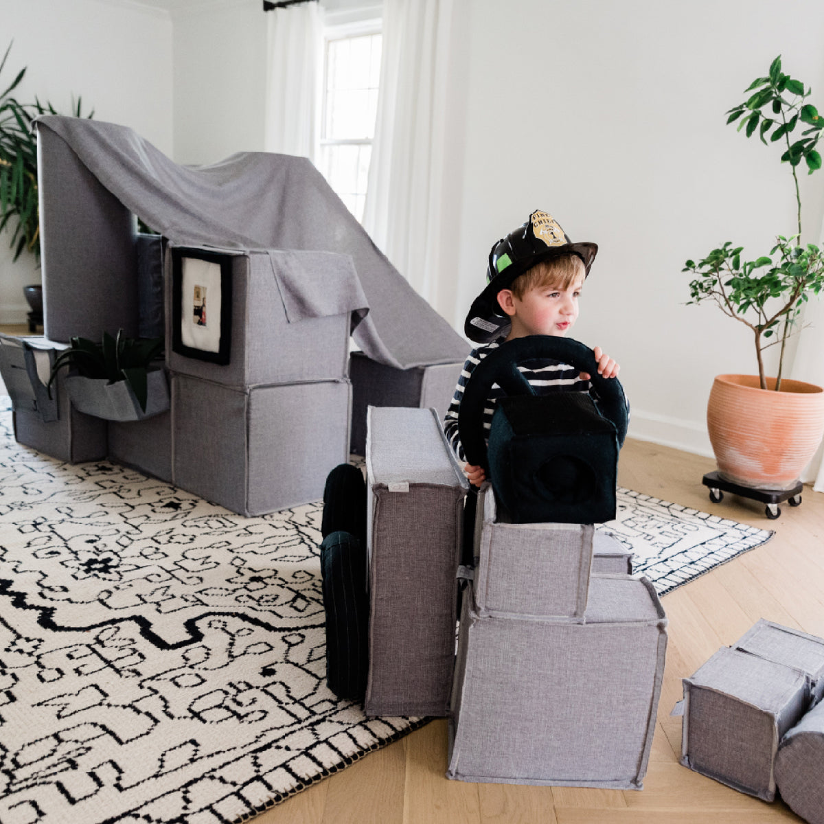 Fort building and Firetruck pretending. Little Creatives provides modern play furniture with beautiful fabrics.